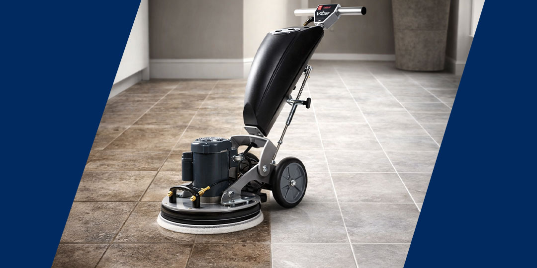 Commercial hard floor cleaning machine polishing tiled floor with visible before and after effect