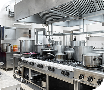 commercial-kitchen-cleaning-services Commercial kitchen with multiple large pots on a gas range, stainless steel surfaces, and an organized layout.