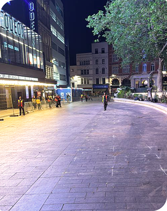 Post-event cleanup outside ODEON Luxe Leicester Square in London after a film premiere or red carpet event.
