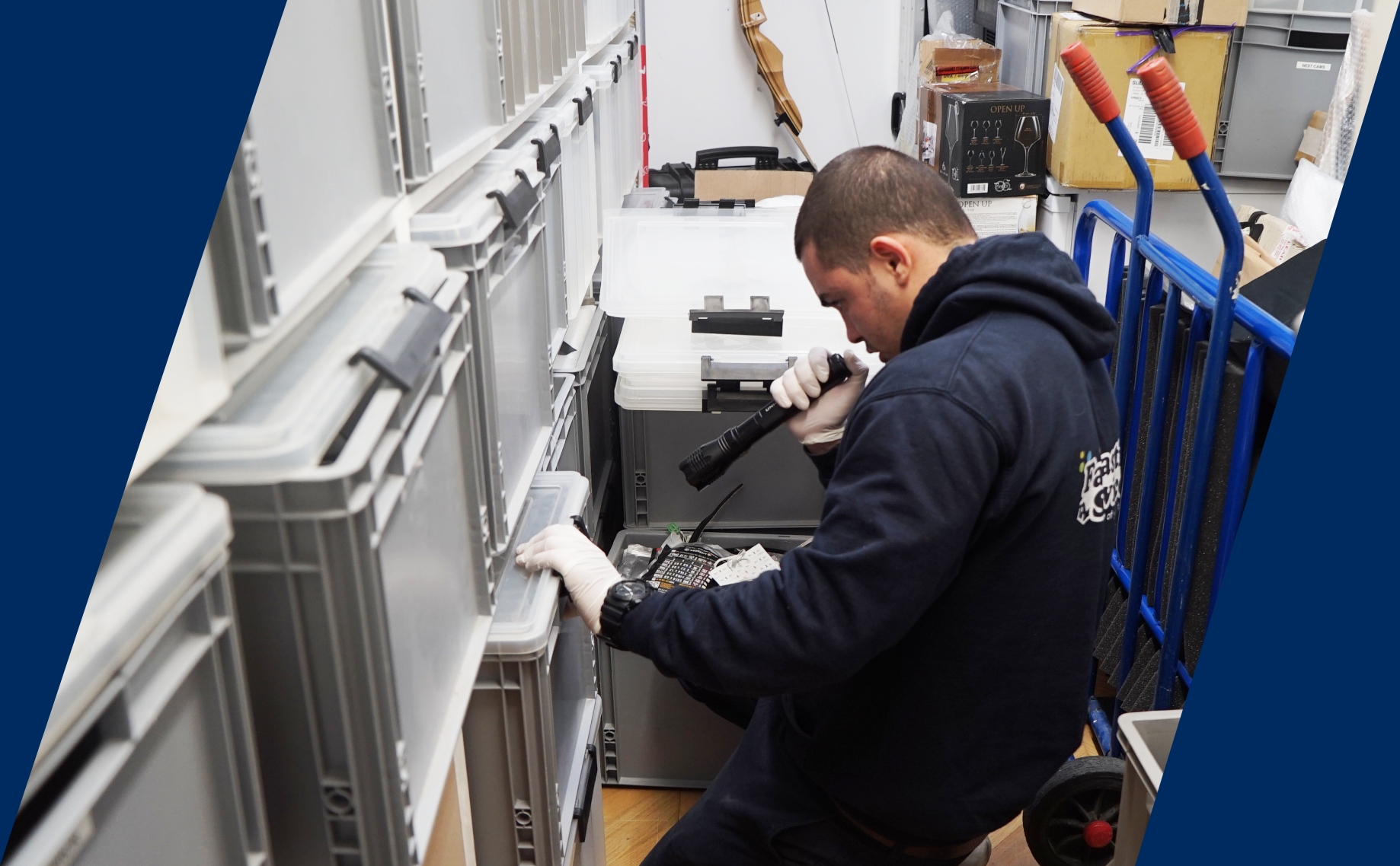 The image shows a pest control professional who is inspecting a storage facility for signs of pest infestation.