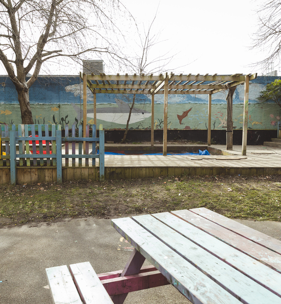children-playground Outdoor children’s playground area with wooden deck and pergola structure