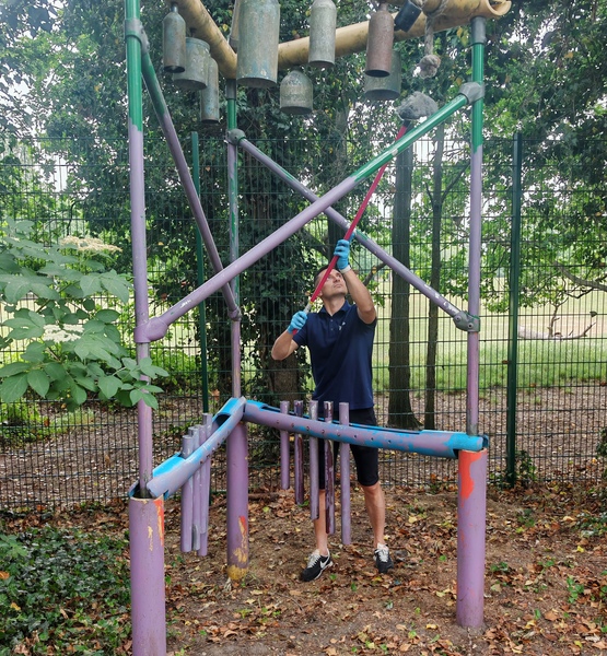 refreshing-play-equipment-lady-allen-playground Volunteer repainting outdoor play equipment as part of the site refurbishment.