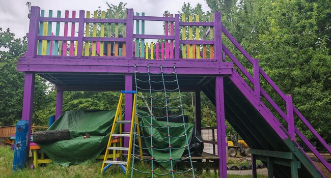 refurbishment-of-lady-allen-adventure-playground Refreshed climbing frame at Lady Allen Adventure Playground, repainted in bright colours as part of the outdoor refurbishment.
