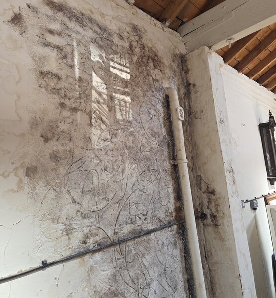 mould-affected-wall-after-cleaning Mould-affected workshop wall after professional mould cleaning and treatment